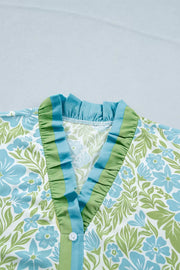 Charming floral mini dress with ruffled V-neck and button front detail.