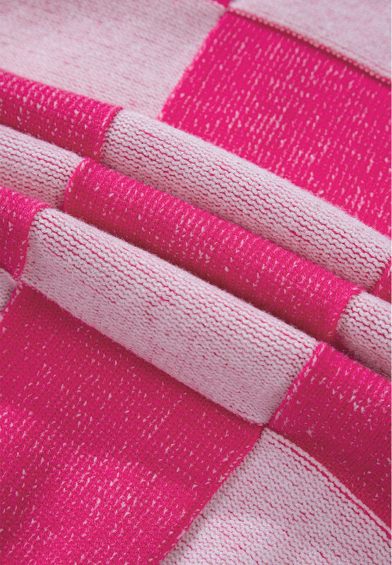 Hot pink and white checkerboard knit cardigan fabric detail