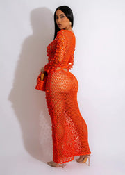 Orange mesh cutout maxi gown with sequin details and long sleeves.