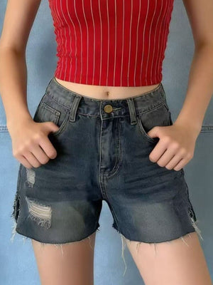Distressed denim shorts with frayed hem and rips, button closure, casual women's shorts.