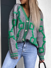 Grey acrylic buttoned cardigan with green geometric chain pattern and ribbed trim.