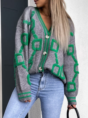 Grey acrylic buttoned cardigan with green geometric chain pattern and ribbed trim.