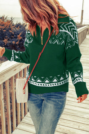 Dark green knit zip-neck pullover with white geometric pattern, ribbed cuffs and hem.