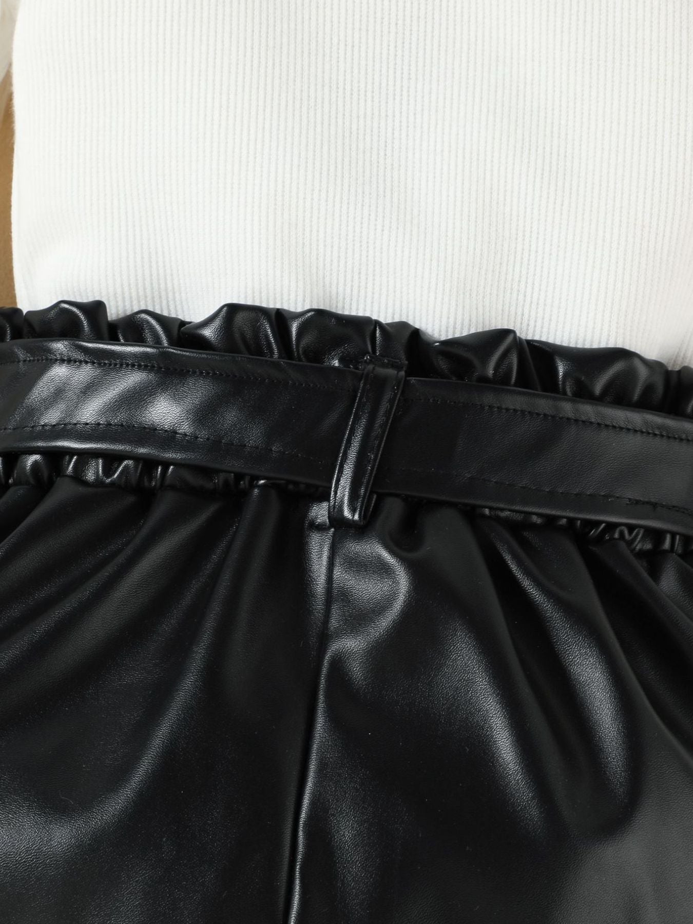 Black faux leather shorts with paperbag waist and belt detail