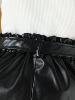 Black faux leather shorts with paperbag waist and belt detail