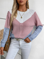 Chevron cable knit sweater in pastel blue, blush pink, and white colorblock with cable knit sleeves and neckline.