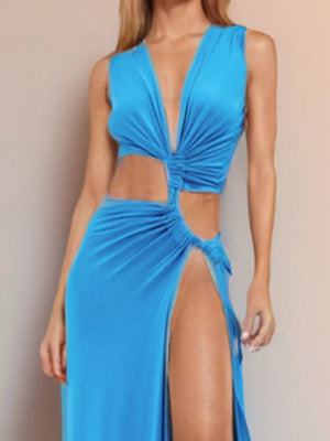 Sky blue maxi dress with plunging V-neck, knotted front, and high slit cutouts.