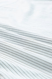 White button-down shirt with subtle pinstripe texture