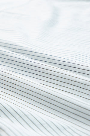 White button-down shirt with subtle pinstripe texture