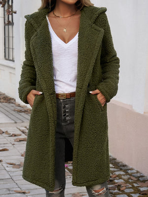 Olive green teddy hooded cocoon coat with pockets and a relaxed fit.