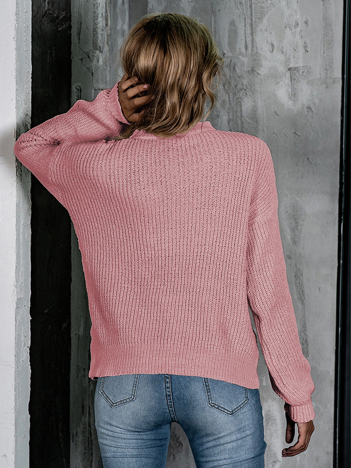 Blush pink openwork knit crew neck pullover sweater with balloon sleeves.