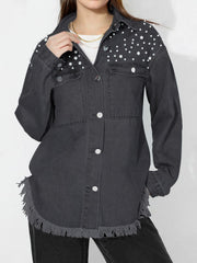 Dark denim shirt with pearl embellishments on shoulders and frayed hem.