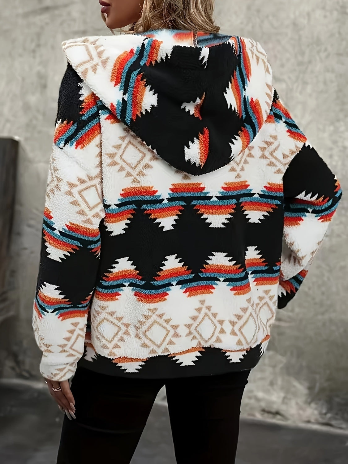 Black sherpa zip hoodie with Aztec geo-print and hood.