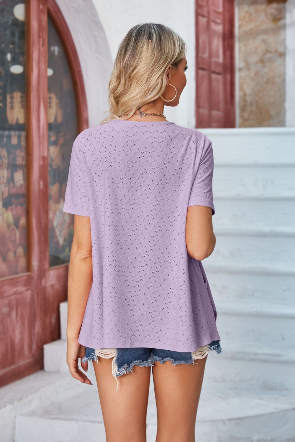 Lavender perforated shawl collar jacket with short sleeves and a relaxed fit.