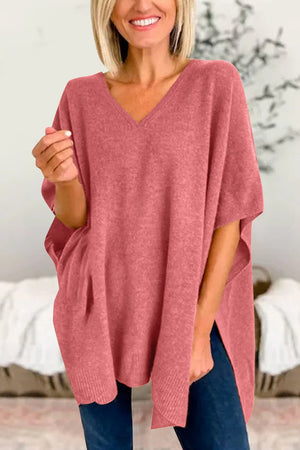 Relaxed V-neck knit poncho top in Dusty Pink with side slits and a relaxed fit.