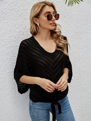 Black chevron knit tie-front cover-up with batwing sleeves and v-neck.