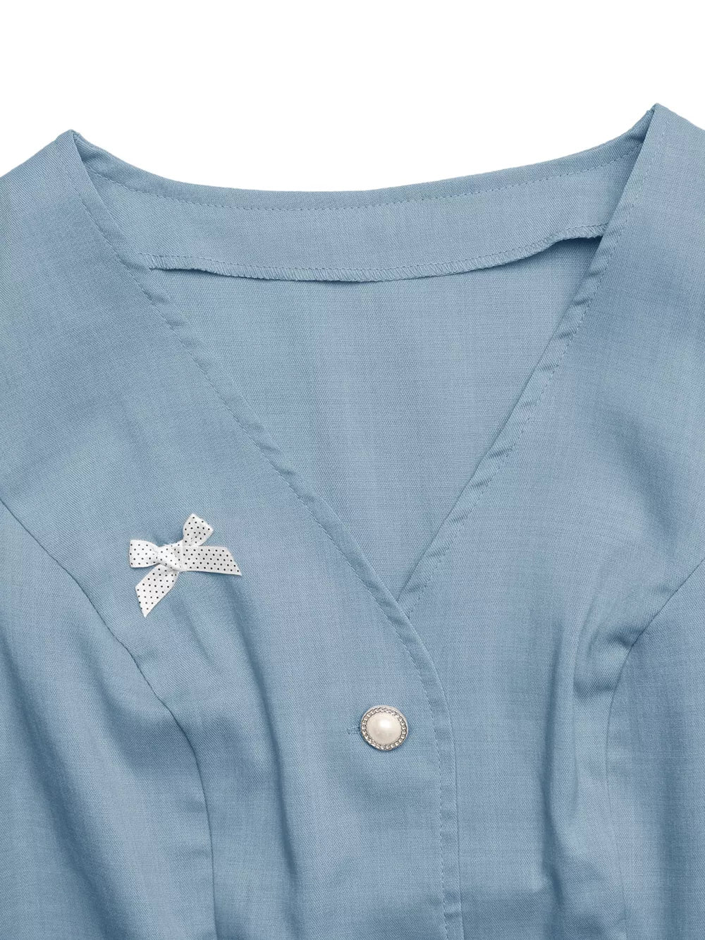 Blue buttoned vest with pearl button and polka dot bow detail
