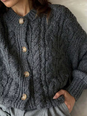 Gray cable-knit button-down cardigan with chunky texture and round buttons.