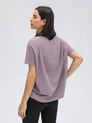 Relaxed fit lilac performance tee with short sleeves and seam detail.