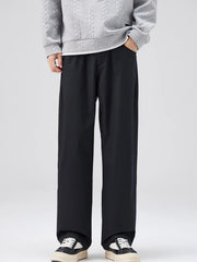 Black oversized casual loose fit pants with a cotton blend, styled with a grey sweater.