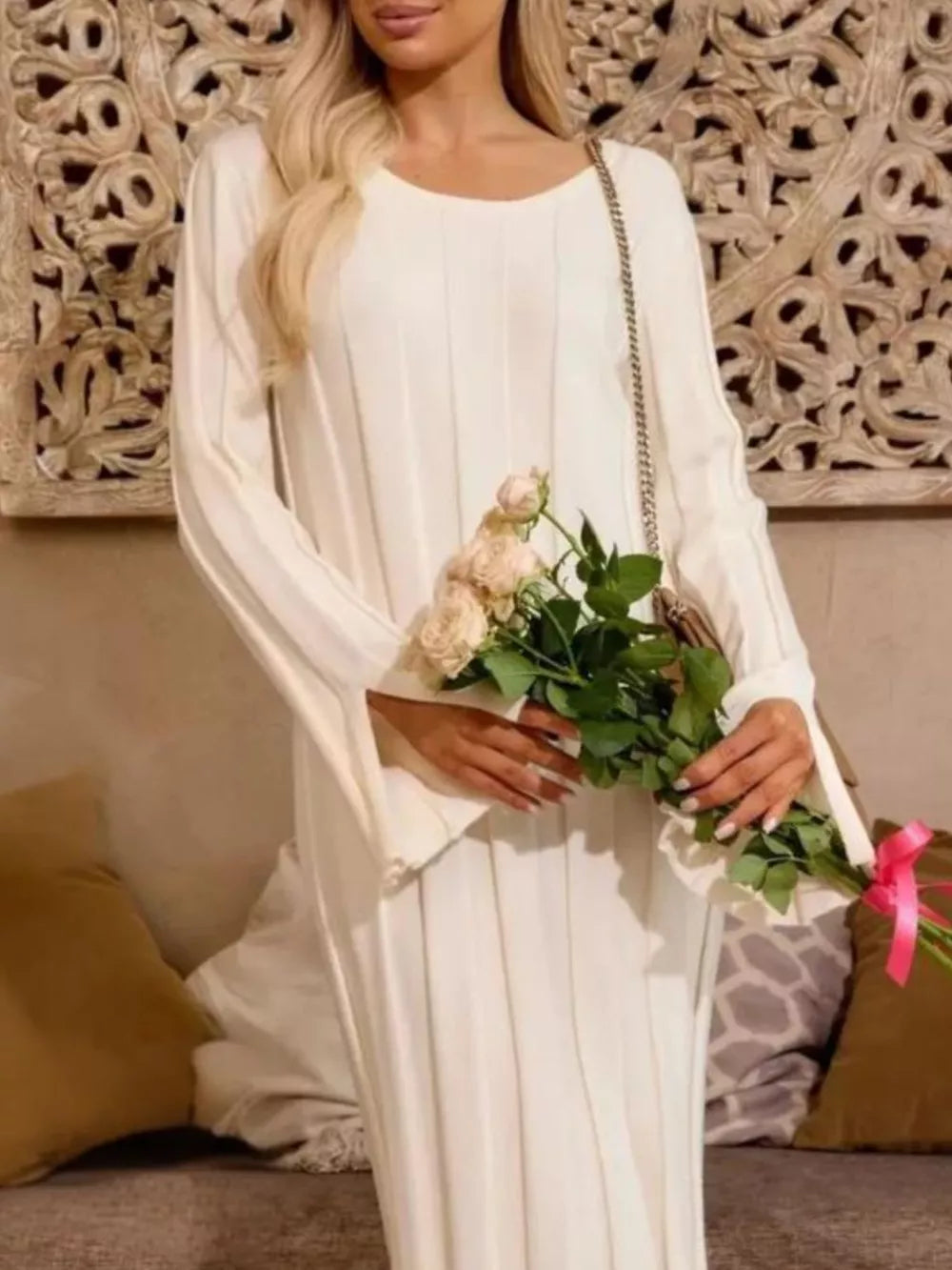 White ribbed knit maxi sweater dress with bell sleeves and a crew neck.