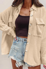 Textured corduroy overshirt in camel with patch pockets and button front.