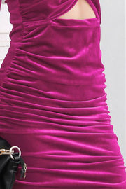 Hot Pink velvet ruched mini dress with cut-out detail and gold hardware purse detail.