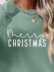 Sage green crewneck sweatshirt with white Merry Christmas graphic.