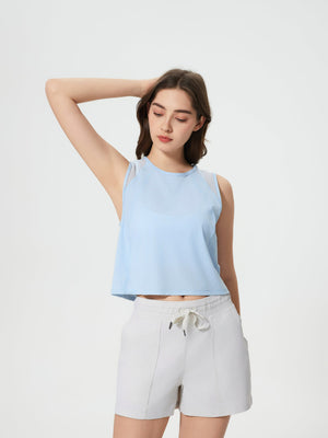 Baby blue cropped active tank top with mesh inset shoulders.