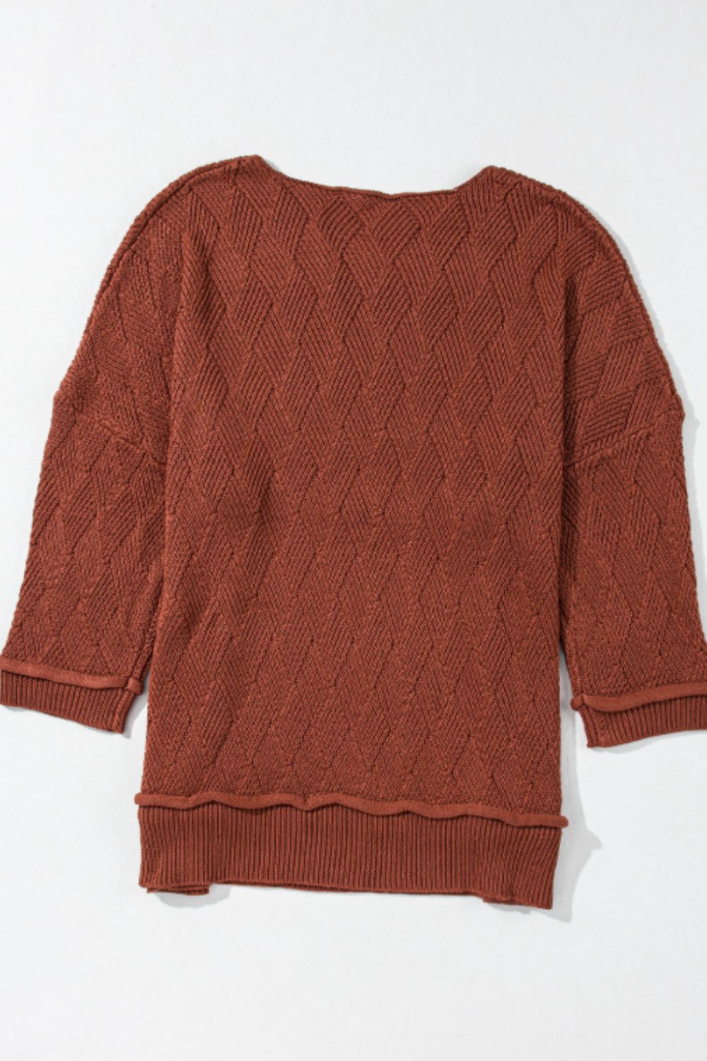 Textured diamond knit sweater in rust with relaxed fit and 3/4 sleeves.