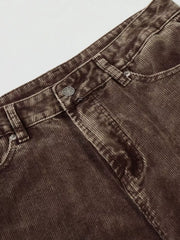 Brown corduroy joggers for men, featuring a button fly and classic pocket details.