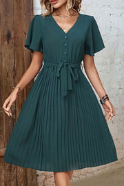 Forest green midi dress with flutter sleeves, V-neck, buttons, and a tie belt.