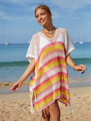 Rainbow stripe crochet beach poncho with V-neck and fringe hem.