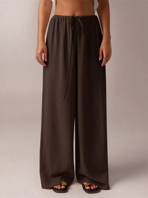 Brown maternity wide-leg pants with drawstring waist and relaxed fit.