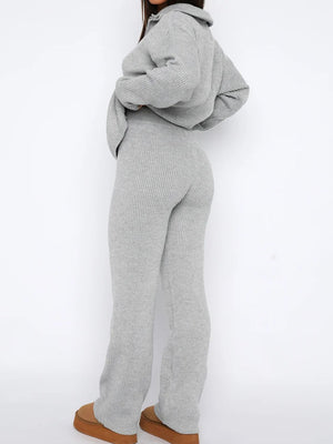 Gray ribbed knit lounge set with quarter-zip top and flared pants.