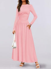 Pink ruched long sleeve maxi dress with pockets and crew neck.
