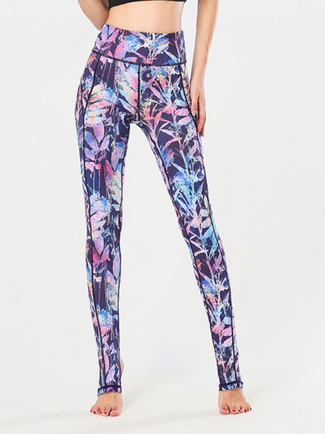 Prism Palm stirrup leggings in a vibrant floral print with a high waist and performance fabric.