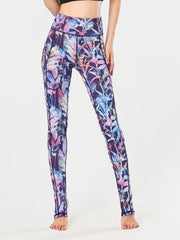 Prism Palm stirrup leggings in a vibrant floral print with a high waist and performance fabric.