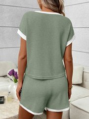 Sage ribbed knit two-piece set with white trim, short sleeve top and shorts.