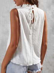 White eyelet tank top with ruffled neckline and back tie detail.