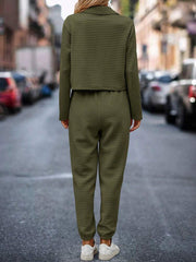 Army green quilted jacket and joggers set with a cropped jacket and cuffed pants.