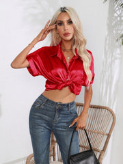 Deep Red satin boxy sleeve blouse with button front and knotted hem.