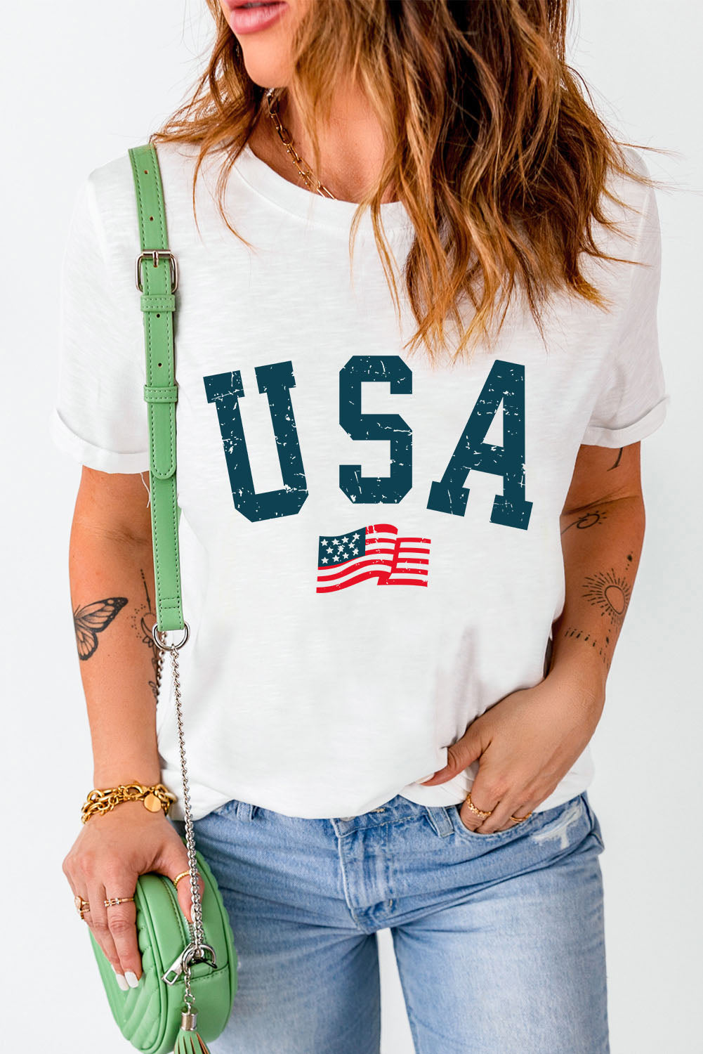 White graphic tee with USA and American flag print, crew neck, short sleeves.