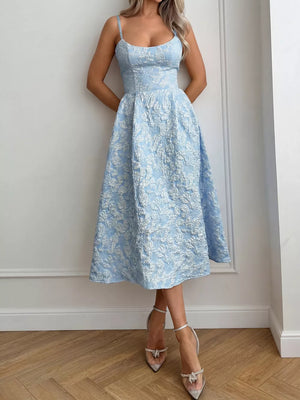 Light blue textured floral a-line midi gown with spaghetti straps and a sweetheart neckline.