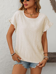 Cream eyelet knit blouse with ruffled short sleeves and a scoop neckline.