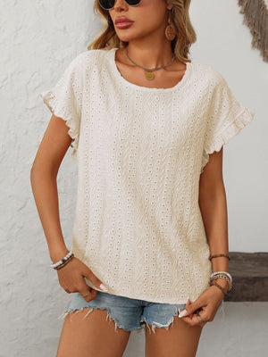 Cream eyelet knit blouse with ruffled short sleeves and a scoop neckline.
