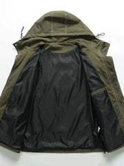Green hooded jacket, open view showing black patterned lining and interior pocket.