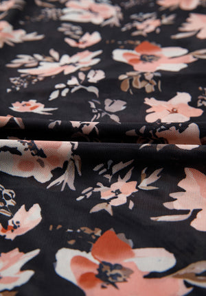 Black sheer floral mock neck blouse with a delicate bloom pattern.