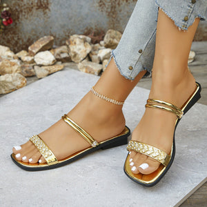 Gold rhinestone-studded square toe flat sandals with double strap detail.