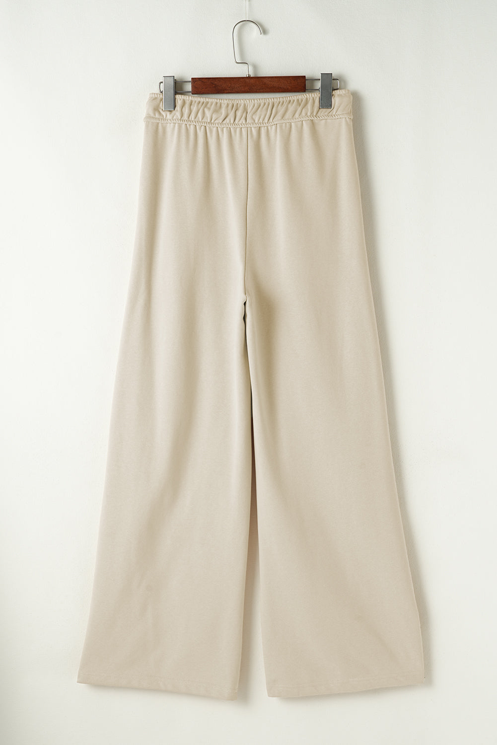 Beige wide-leg drawstring lounge pants with elastic waistband